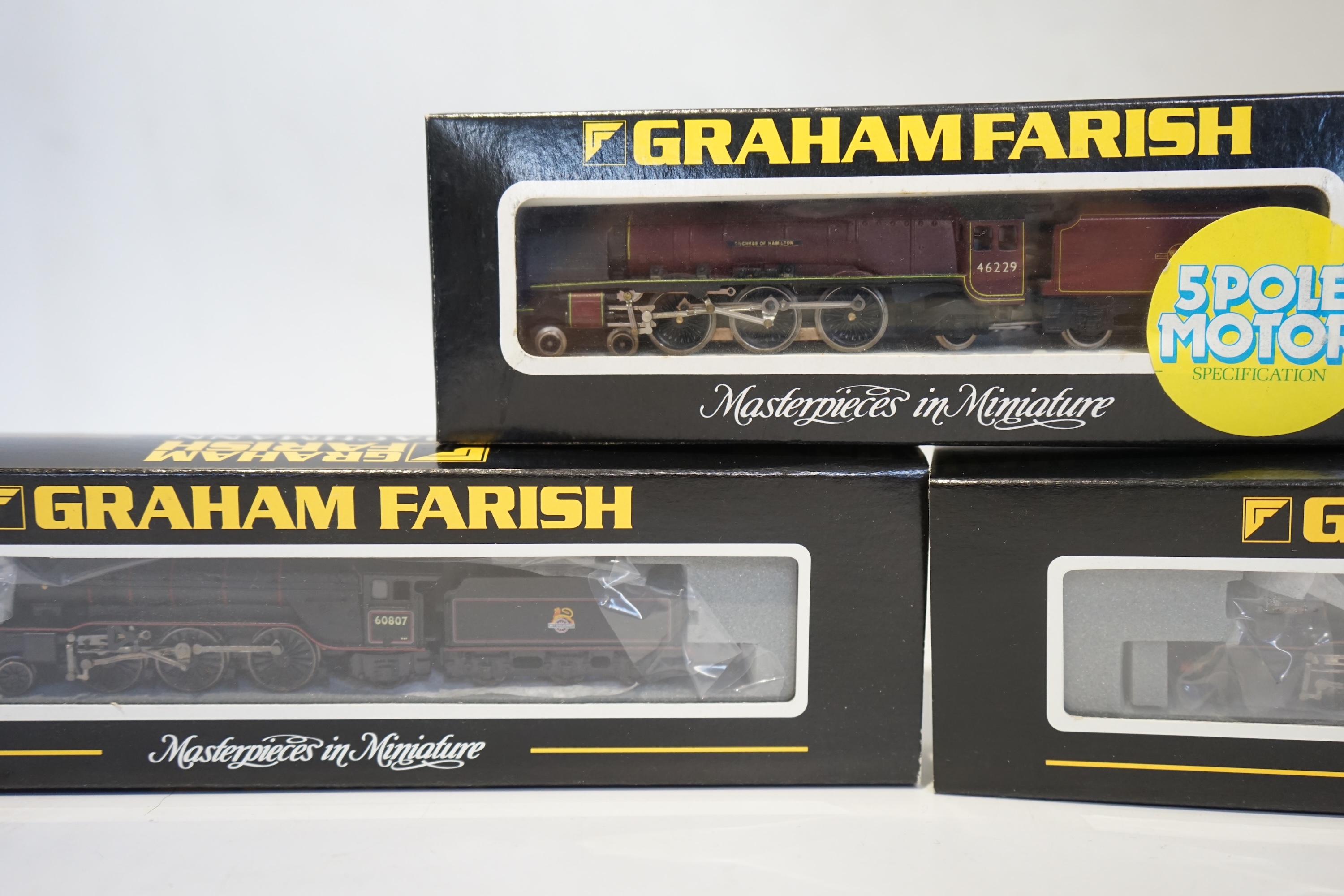 Three boxed Graham Farish N gauge railway BR tender locomotives; a Coronation Class, Duchess of Hamilton (1816), a Class V2, 60807 (372-601), and a Class V2, 60800 (372-600). Condition - good.